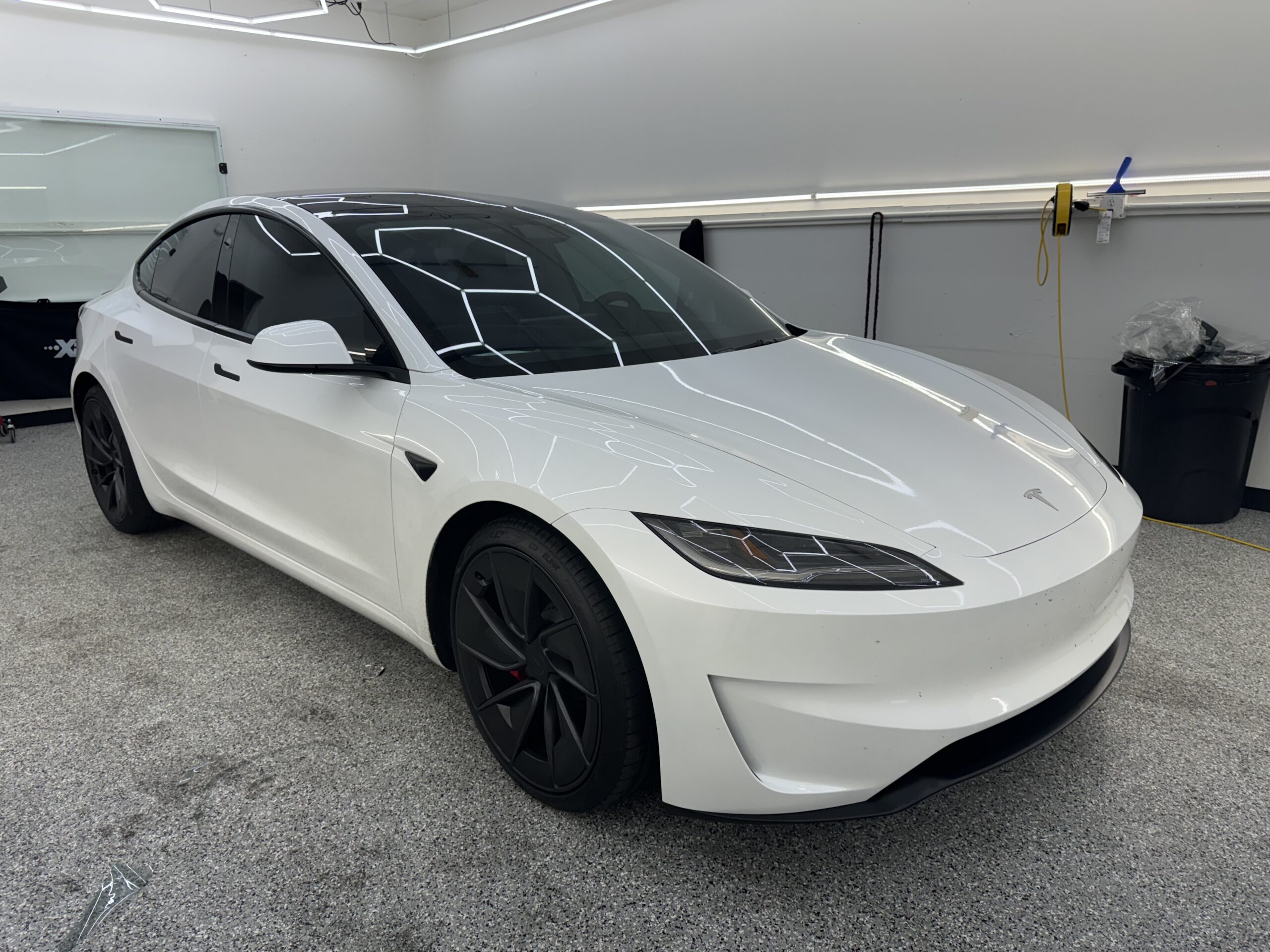 White Tesla Model 3 with XPEL ceramic window tint at Tru-Tints Concord shop